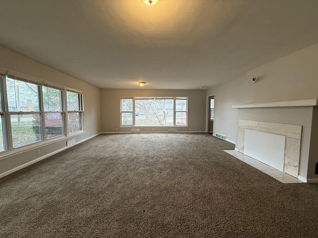 unfurnished living room featuring light carpet