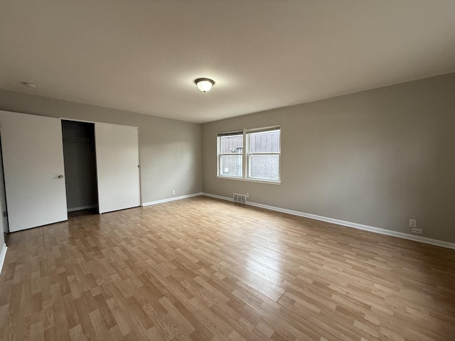 unfurnished room featuring light wood-type flooring