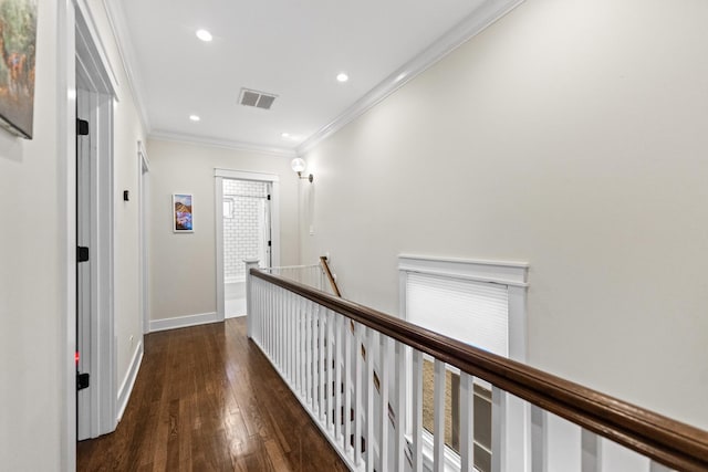 hall featuring ornamental molding and dark hardwood / wood-style floors