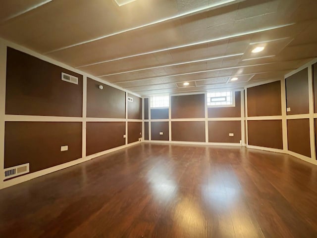 spare room featuring wood-type flooring