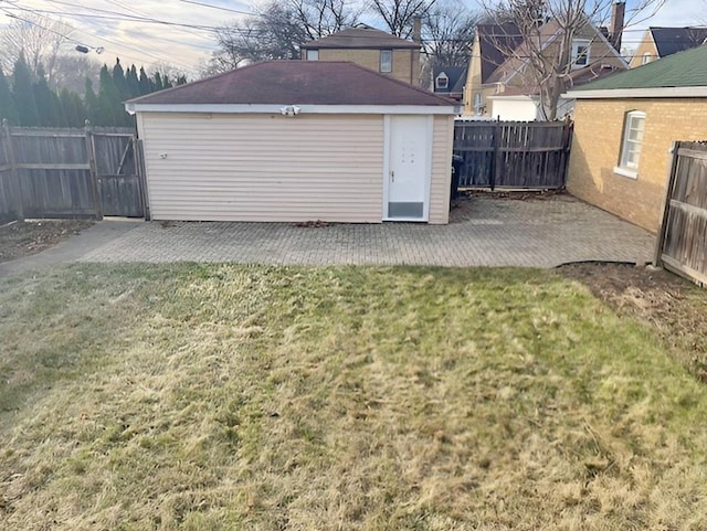 view of yard with a patio area and an outbuilding