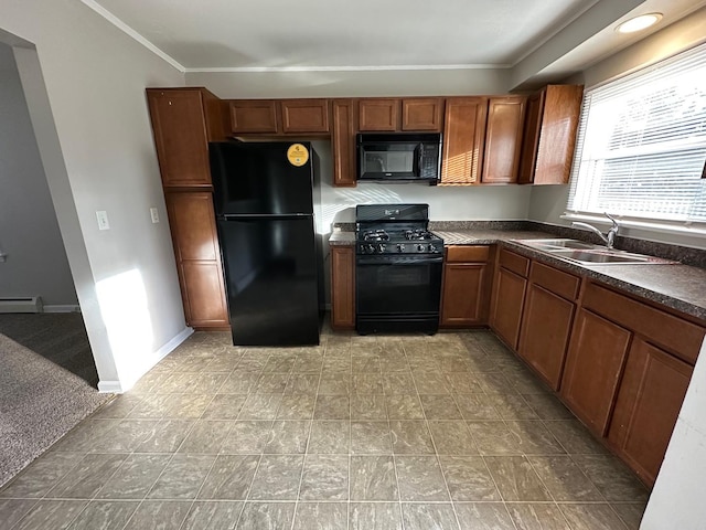 kitchen featuring ornamental molding, sink, a baseboard heating unit, and black appliances