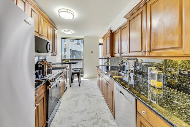 kitchen with appliances with stainless steel finishes and sink