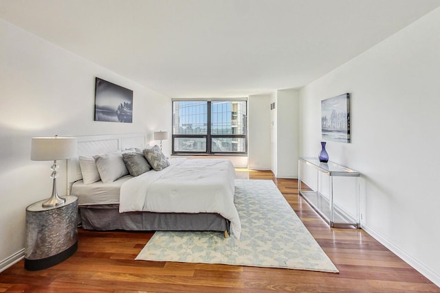 bedroom featuring hardwood / wood-style flooring