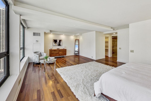 bedroom with dark hardwood / wood-style flooring