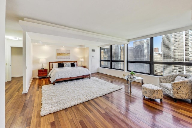 bedroom with hardwood / wood-style floors