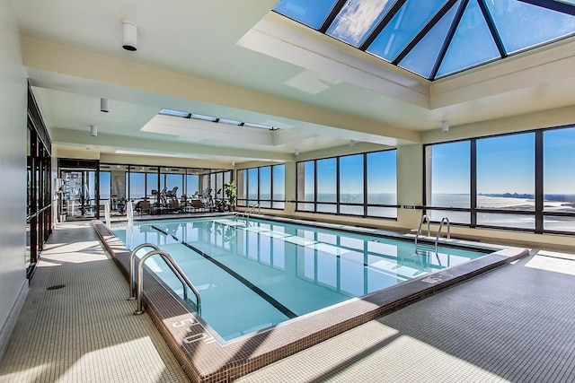 view of swimming pool with a water view