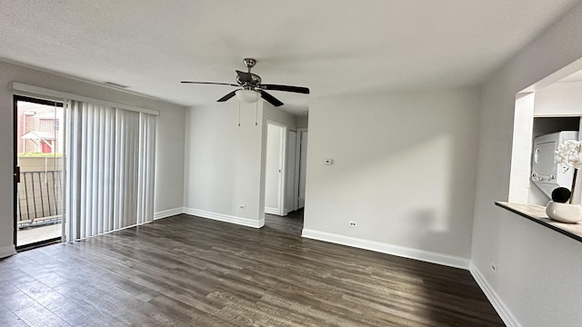 unfurnished room with a textured ceiling, ceiling fan, and dark wood-type flooring