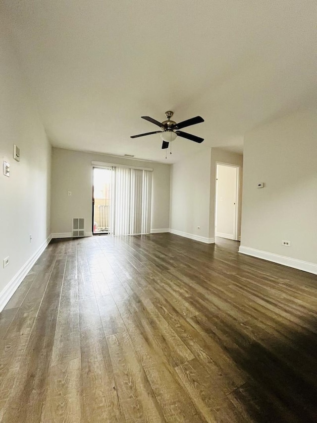 unfurnished room with ceiling fan and dark hardwood / wood-style floors