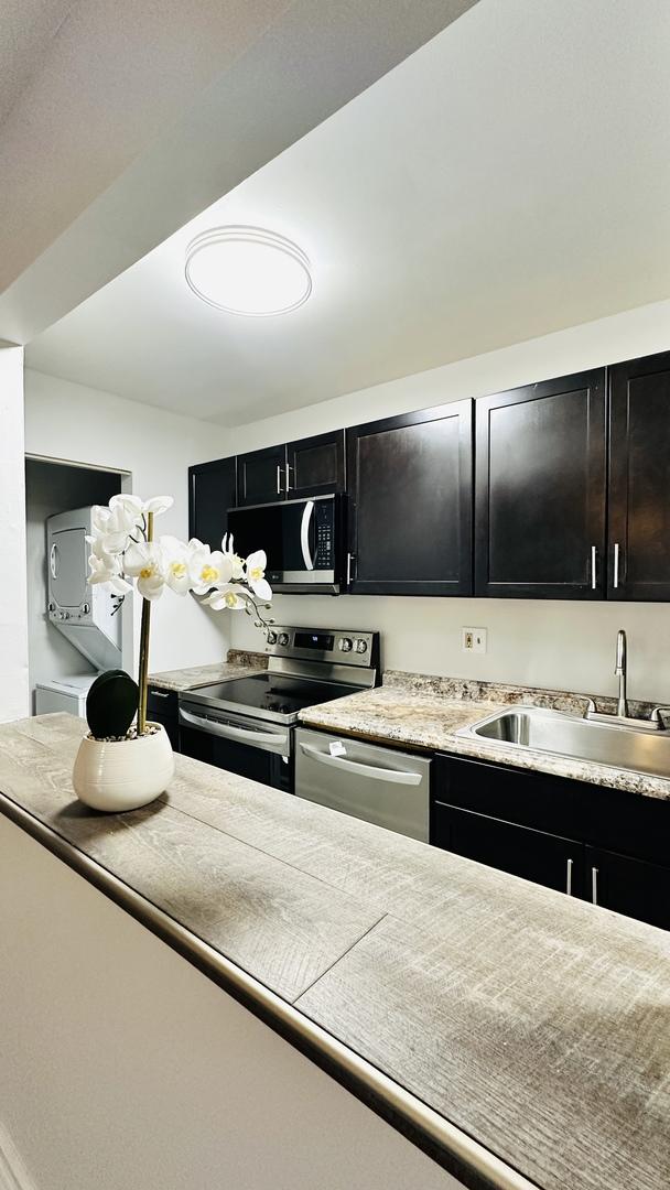 kitchen with appliances with stainless steel finishes and sink