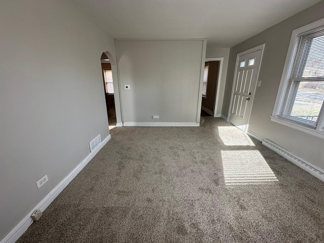 unfurnished room featuring carpet