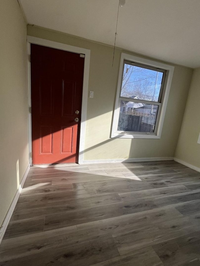 unfurnished dining area featuring hardwood / wood-style floors