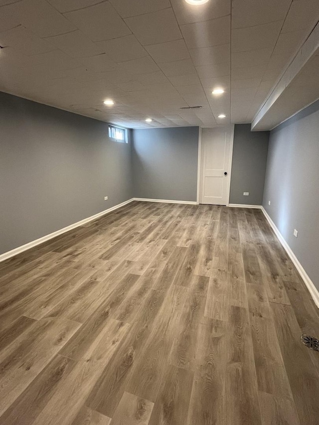 basement featuring hardwood / wood-style floors