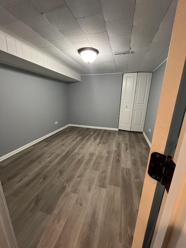 basement featuring wood-type flooring