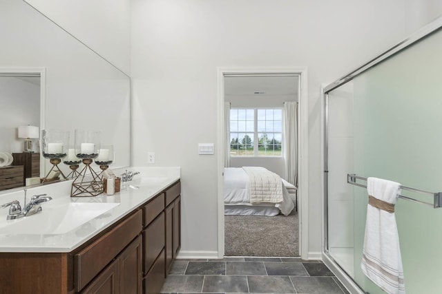 bathroom featuring tile patterned floors, vanity, and a shower with shower door