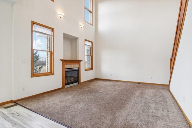 unfurnished living room featuring a fireplace