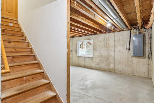 basement featuring electric panel