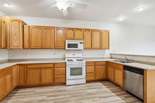 kitchen with ceiling fan, white appliances, sink, and light hardwood / wood-style flooring