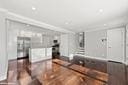 kitchen with dark hardwood / wood-style floors and ornamental molding