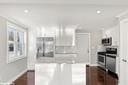 kitchen with white cabinetry and appliances with stainless steel finishes