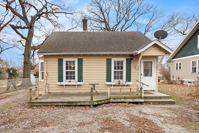 bungalow-style home with a deck