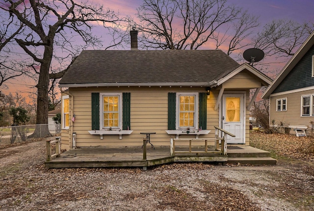 bungalow-style house featuring a deck