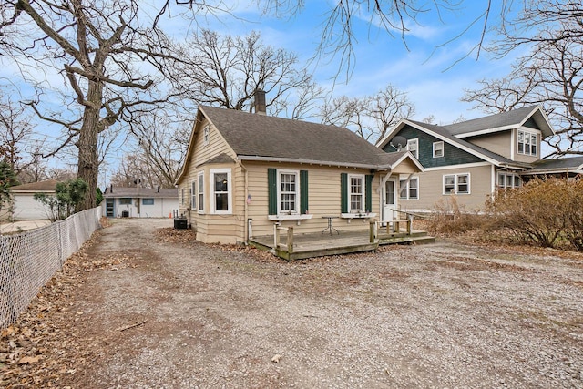 exterior space with a wooden deck and central AC unit