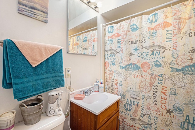 bathroom with vanity, toilet, and walk in shower