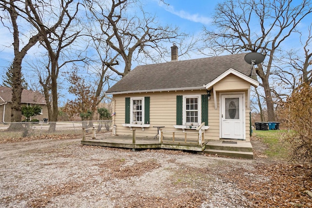 bungalow with a wooden deck