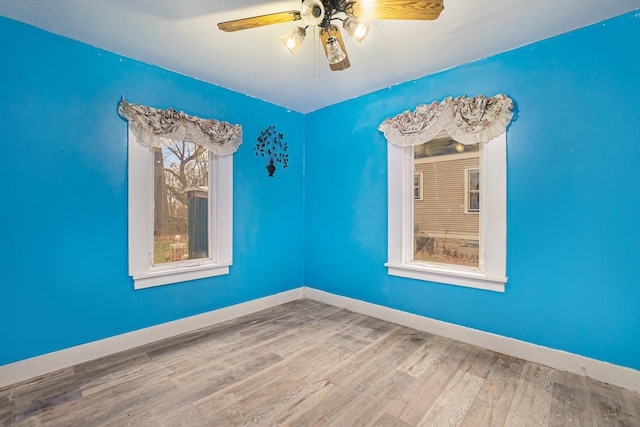 unfurnished room featuring wood-type flooring and ceiling fan