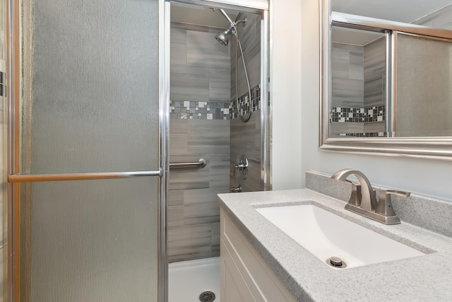 bathroom with vanity and walk in shower