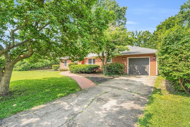 view of front of home featuring a garage and a front lawn