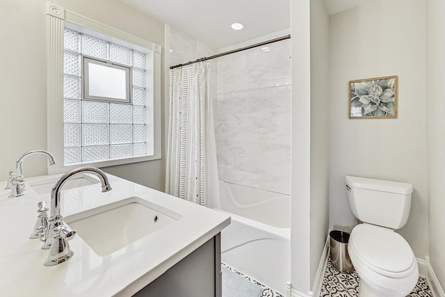 full bathroom with tile patterned floors, vanity, toilet, and shower / tub combo