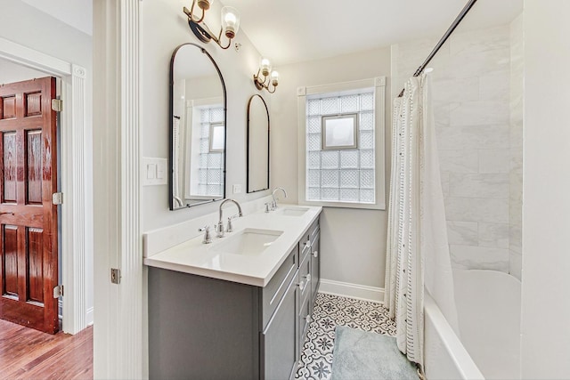 bathroom featuring shower / bath combo, vanity, and hardwood / wood-style flooring