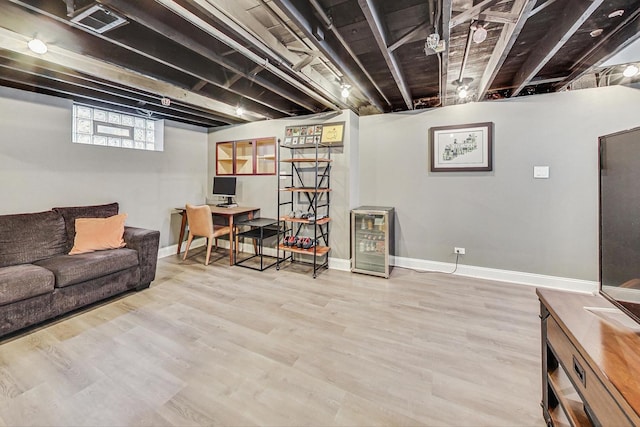 living room with wood-type flooring and beverage cooler