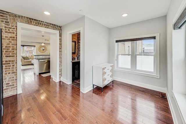 interior space with hardwood / wood-style floors and a healthy amount of sunlight