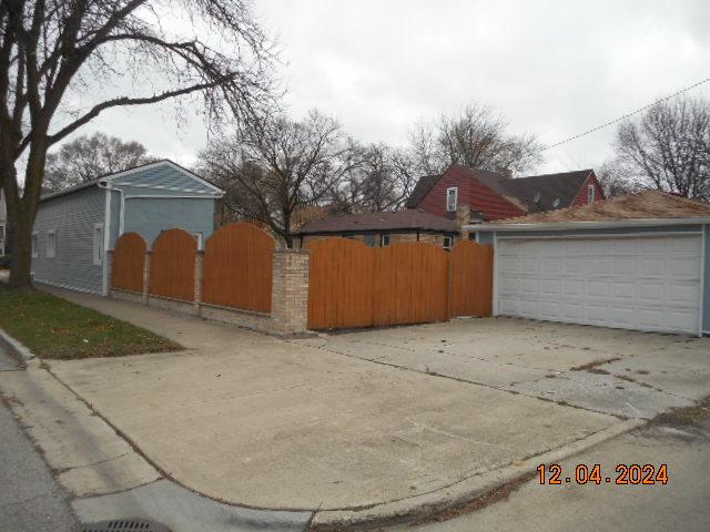 view of home's exterior featuring an outbuilding and a garage