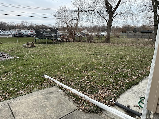 view of yard featuring a patio and a trampoline