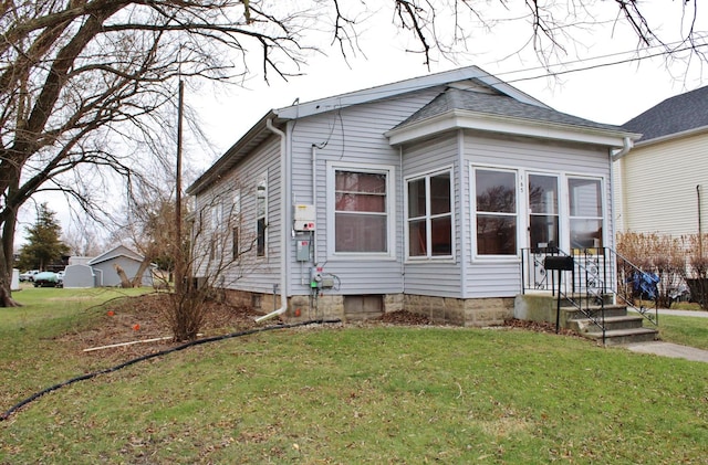 view of home's exterior featuring a lawn