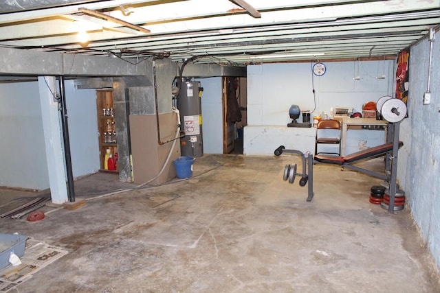 basement featuring gas water heater and heating unit