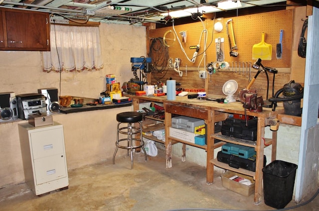 basement with a workshop area