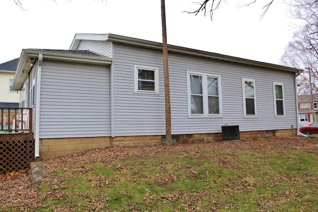 view of side of home featuring central AC unit