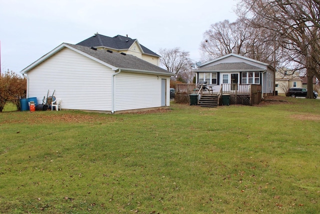 view of home's exterior featuring a wooden deck and a yard