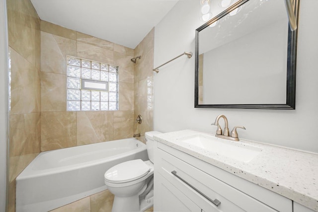 full bathroom with tile patterned floors, toilet, vanity, and tiled shower / bath