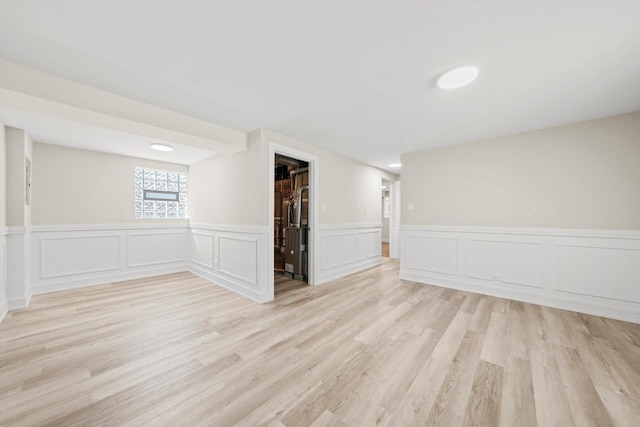 spare room featuring light hardwood / wood-style floors