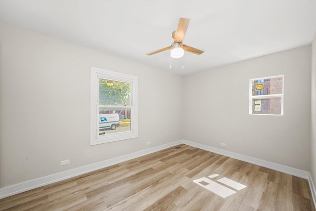 spare room featuring ceiling fan and light wood-type flooring