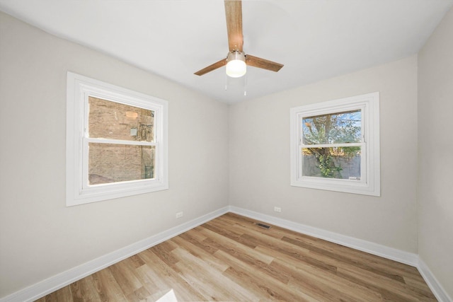 empty room with light hardwood / wood-style floors