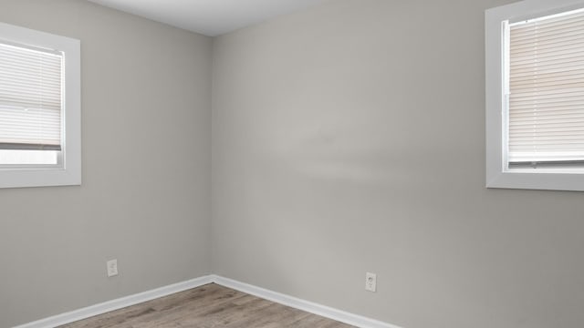 spare room featuring light hardwood / wood-style flooring