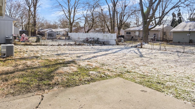 view of yard featuring central air condition unit