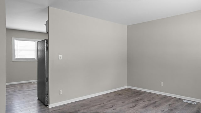 spare room featuring hardwood / wood-style flooring